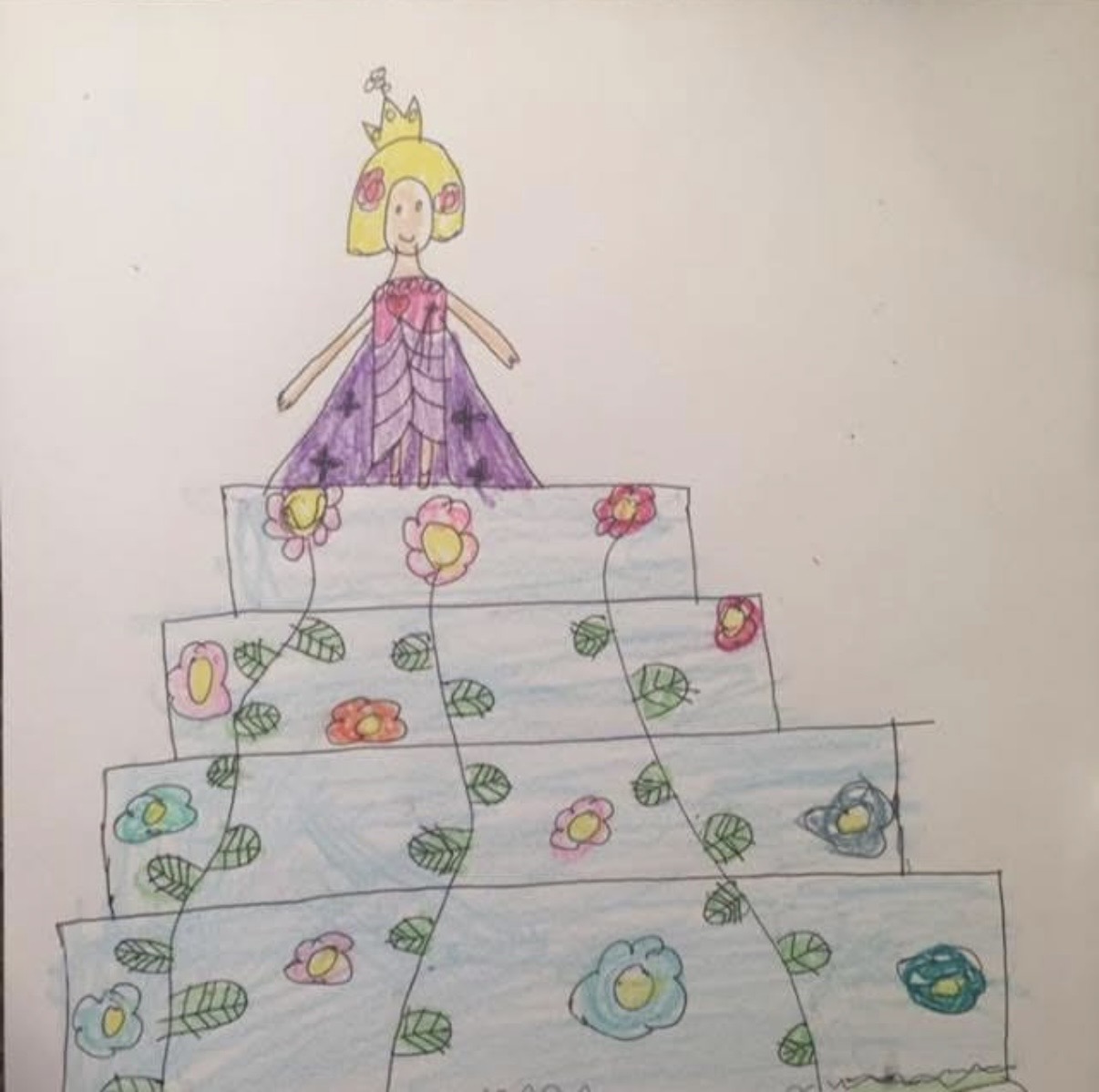 A child's drawing of a princess on a tiered floral cake